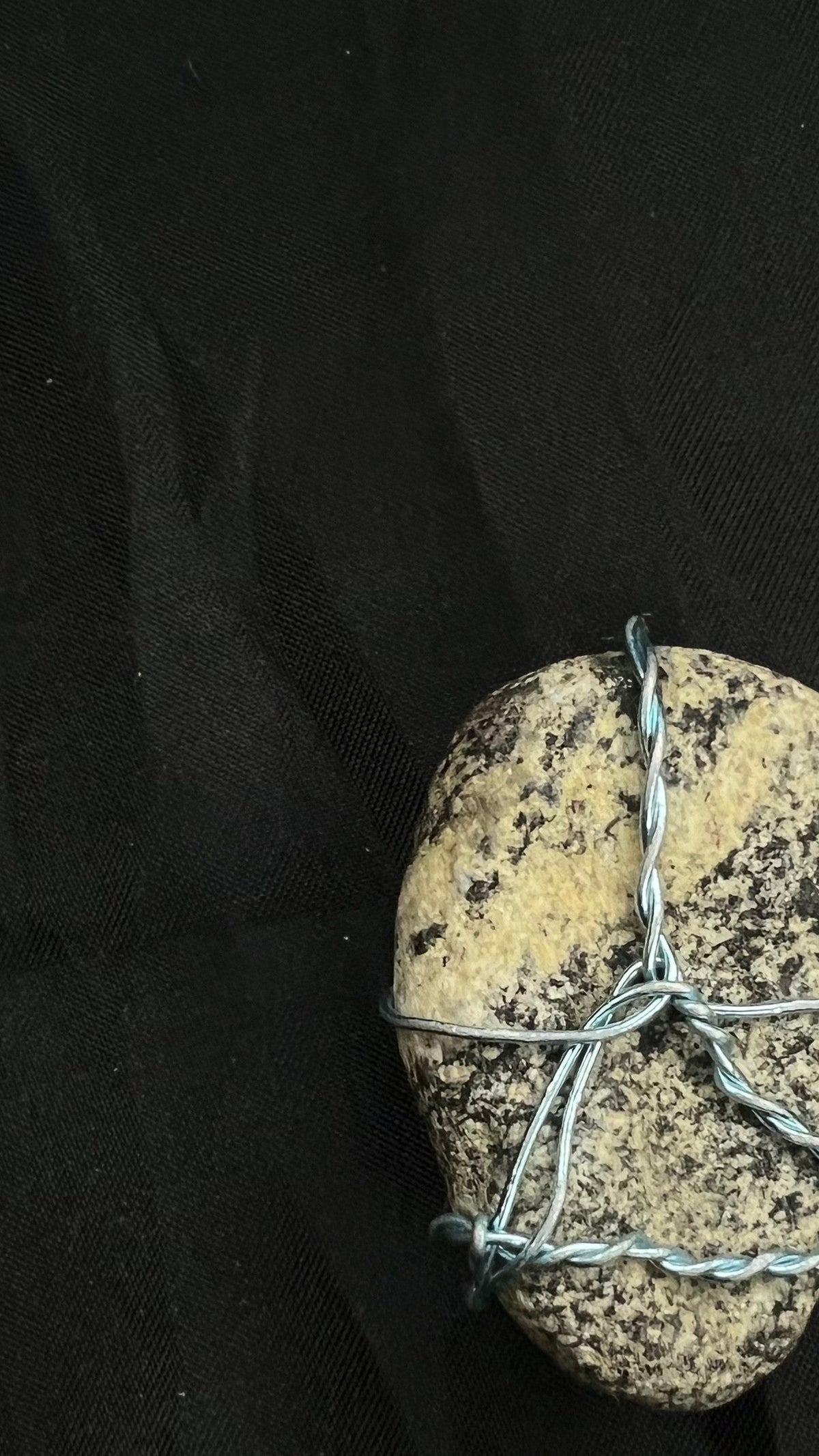 Alternate close view of the actual Dalmatian River Pebble pendant